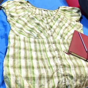 Light green,  white,  and tan checked top with puffy sleeves.  Button up.